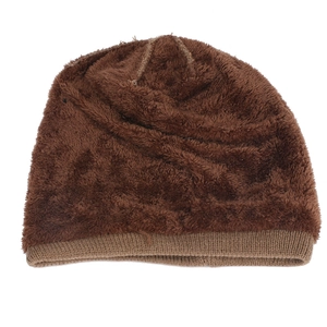 Detail of dark brown knit beanie with thick fleece lining for cold weather warmth