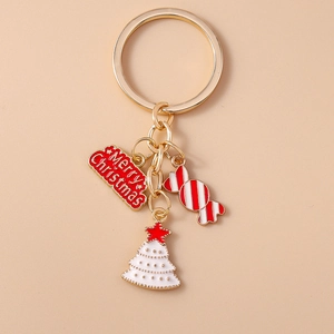Detail view of festive metal keychain with Merry Christmas tag, candy, and tree charms