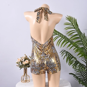 Detail of the backless gold leopard print romper showing halter ties and metallic texture