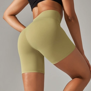 Close-up of olive green high-waisted yoga shorts with seamless texture and lift design