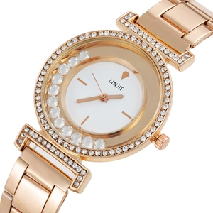 Close-up of rose gold fashion watch with rhinestone bezel and floating dial crystals