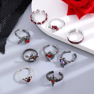 9-piece Gothic ring set featuring red hearts and silver crosses on white stone