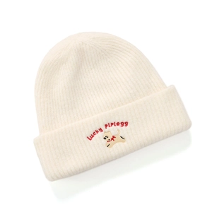 Close-up of the detailed puppy embroidery and Lucky letter text on a knit beanie