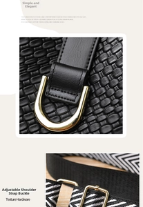 Detail of black woven leather texture with gold D-ring and striped shoulder strap