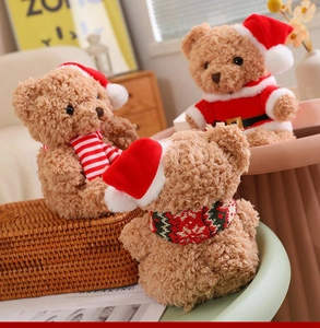 Three brown plush teddy bears wearing festive Christmas scarves and Santa Claus outfits