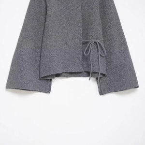 Grey thick knitted cardigan with split cuffs and side drawstring bow tie detail