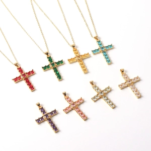 Detailed view of colorful zircon cross pendants with gold-plated copper chains