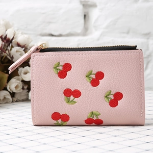 Pink PU leather wallet with detailed cherry embroidery on checkered tablecloth
