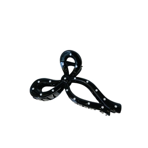 Elegant black bow hair claw clip with white polka dots for women daily hairstyling