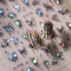 Translucent butterfly and floral nail stickers with glitter and rhinestone accents