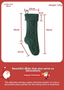 Detail view of a 46cm green cable knit Christmas stocking with size specifications