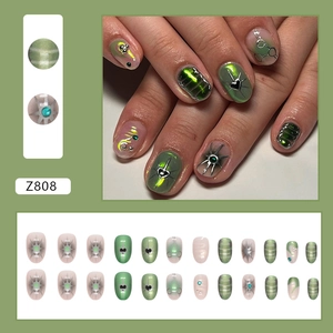 Green press-on nails with starburst and heart design, sweet cool Y2K style set