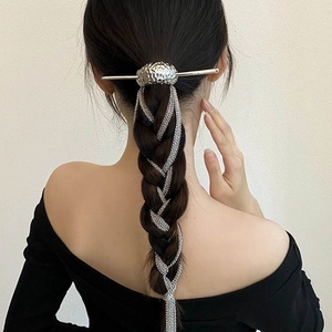 Silver fringe tassel hair pin in modern Chinese style shown on braided ponytail hairstyle
