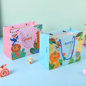 Cartoon birthday gift bags in pink and blue colors with animal prints and woven handles