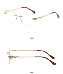 Detail of rimless rectangle sunglasses with sparkling rhinestones and golden metal temples