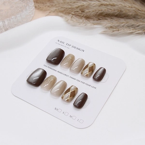 Handmade cat-eye press-on nails set with checkered patterns and brown shimmer details