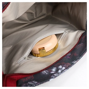 Internal view of floral tote bag with grey herringbone lining and zipper pocket