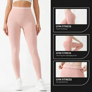 Pink high-waisted seamless yoga leggings with peach hip design and shaping texture