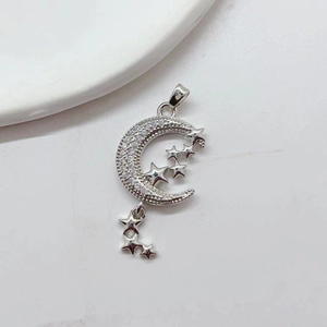 Silver crescent moon necklace pendant with sparkling zircon stars on white background