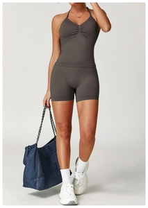 Detail of grey seamless yoga vest with ruched chest design and matching high waist shorts