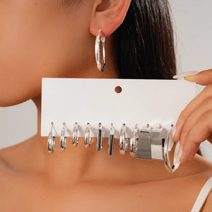 Twelve-piece set of silver geometric hoop earrings in various circular and square designs