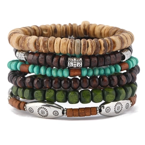 Detail of multi-layer handmade wooden beads and turquoise accents on elastic bracelets