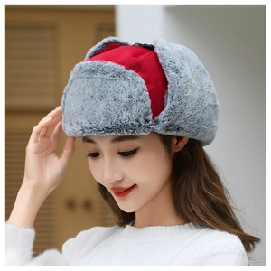 Detail of red windproof winter hat with thick grey faux fur lining and ear flaps