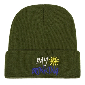 Army green ribbed knit beanie featuring Day Drinking embroidery and sun icon on white background