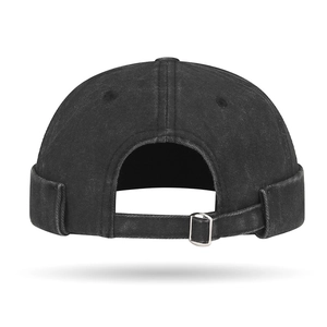 Washed black cotton docker hat with adjustable metal buckle and faded vintage texture