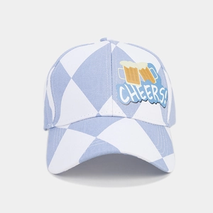 Close-up of a blue and white checkered baseball cap with a Cheers beer embroidery patch