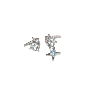 Asymmetric silver star earrings with zircon and moonstone inlay on a clean white background