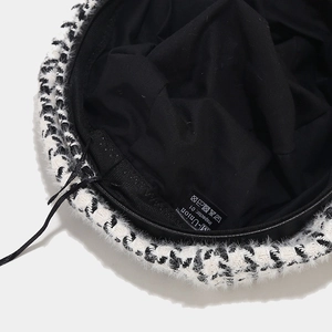 Black and white houndstooth beret hat with soft texture and M-Union brand label