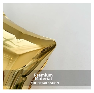 Macro shot of high-shine gold acrylic star bag surface with metallic mirror finish