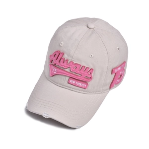 Detail of distressed brim and pink 3D embroidery on vintage beige cotton baseball cap
