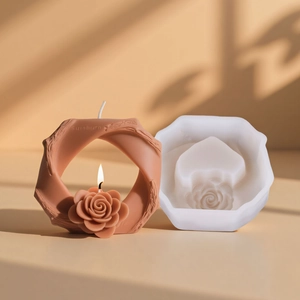 Stampo in silicone e candela ad anello intrecciato con rosa in luce calda artistica