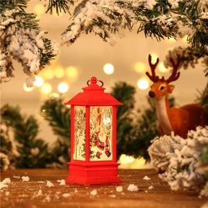 Detail of red Christmas lantern featuring Santa Claus print and LED warm lighting