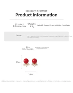 Detail view of red 18k gold plated stud earrings with pearl and zircon, size 1.5x1.3cm