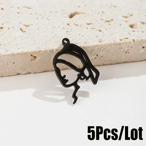Detailed view of 5-piece set of stylized ponytail girl silhouette pendant in black metal