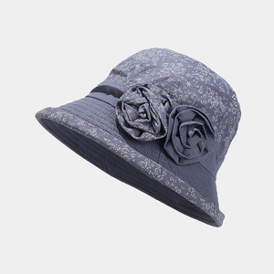 Detailed macro view of the breathable blue grey floral sun hat with 3D flower accents