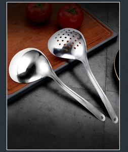Detailed view of 304 stainless steel soup ladle and slotted spoon set on a wooden board