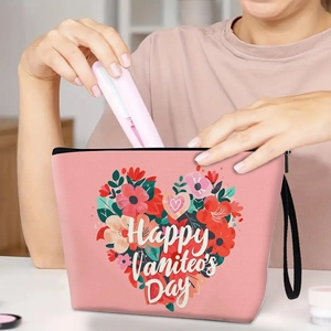 Pink canvas cosmetic bag with floral heart and Happy Valentine's Day print with wristlet
