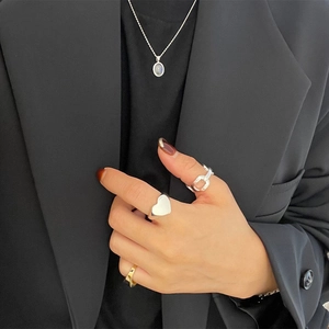 925 silver necklace and rings set with cat-eye stone on a black suit model