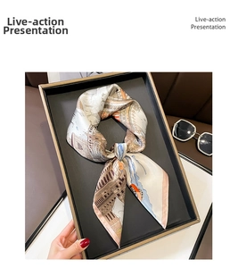 Detail of silk square scarf featuring European architectural prints in a luxury gift box