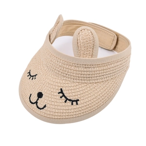 Detail view of straw sun hat with cat embroidery, bunny ears and adjustable velcro strap