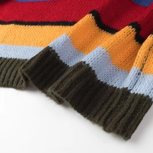 Rainbow striped knit sweater with ribbed cuffs and relaxed colorful retro pattern design