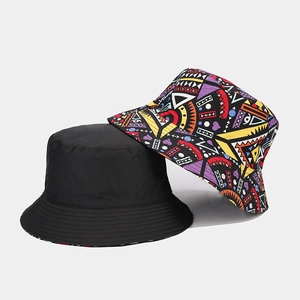 Bohemian reversible bucket hat with colorful geometric pattern and classic black canvas side
