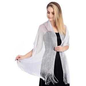 Detailed view of a glittering silver lurex shawl with elegant fringe for bridal wedding parties