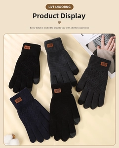 Close-up of touchscreen knit gloves showing diamond pattern and brown wrist labels