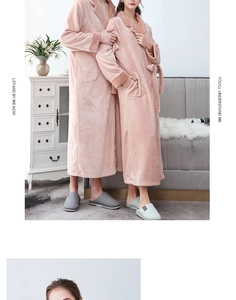 Detailed texture of thick pink coral fleece bathrobe with waffle pattern on collar