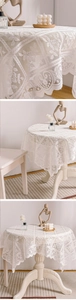 Close-up of white lace tablecloth featuring elegant hollow-out jacquard and wavy edges